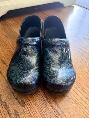 Dansko Black Iridescent Floral Clogs